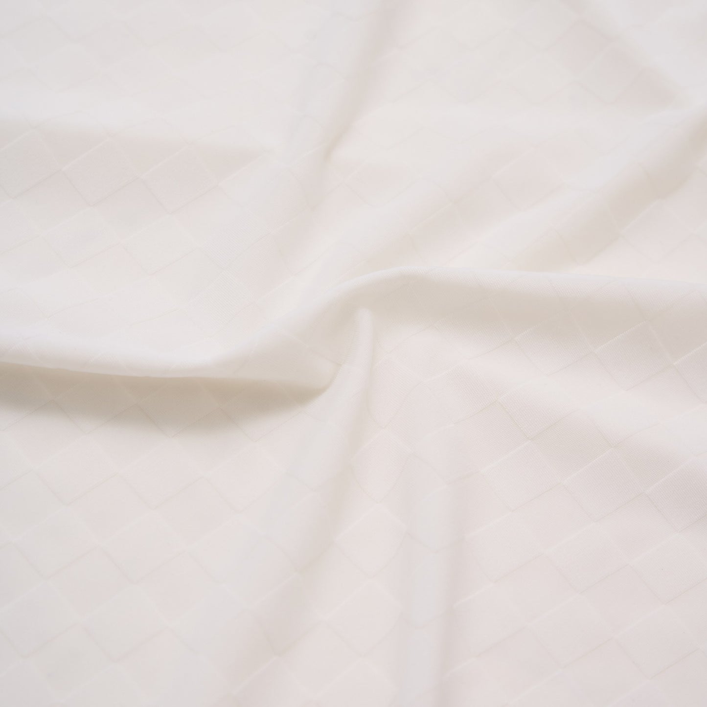 Close-up of beige fabric with subtle texture