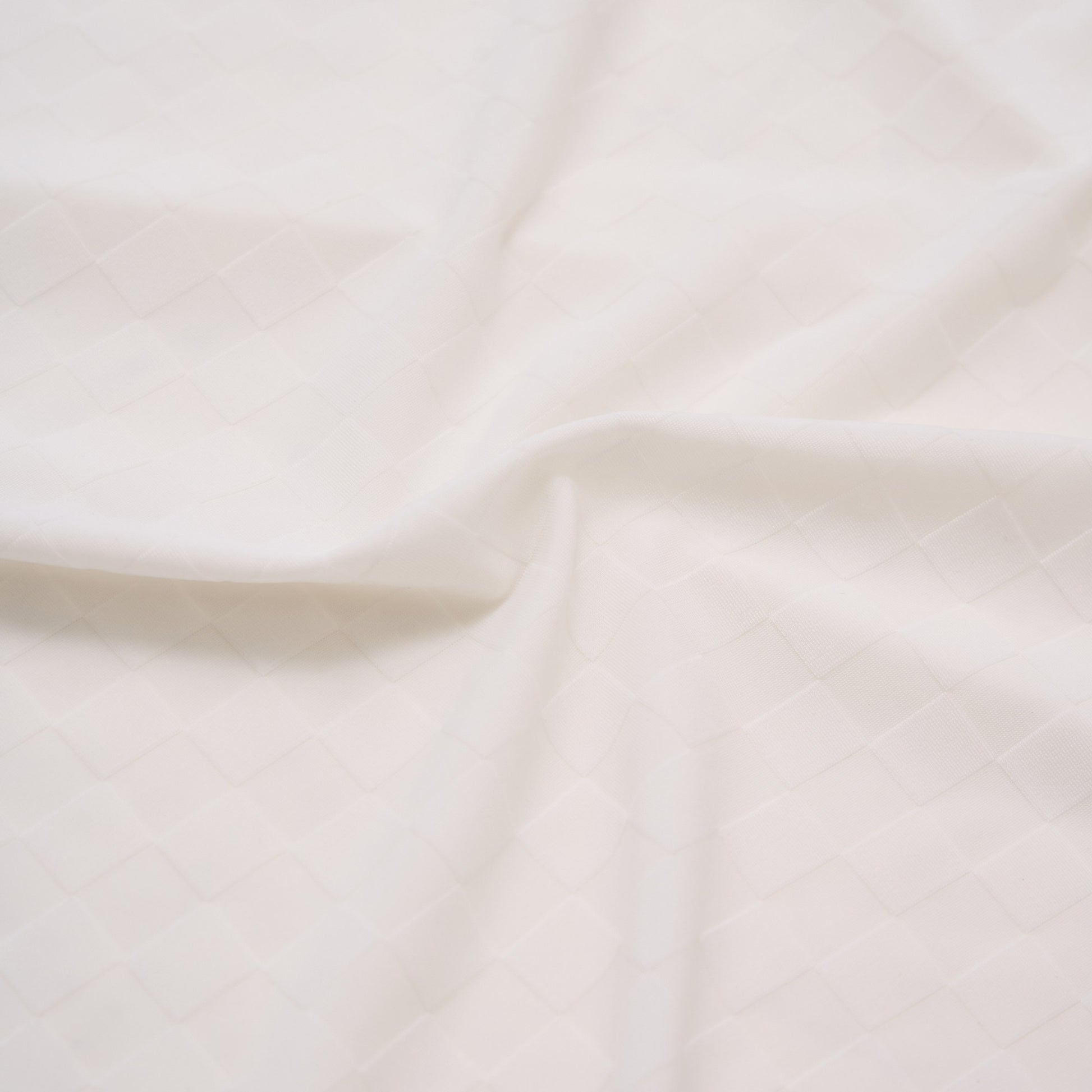 Close-up of beige fabric with subtle texture